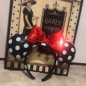 Minnie mouse sequined ears black w white polkadots w red bow —lots of sparkle.